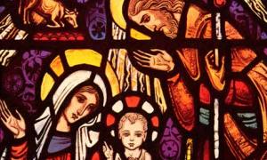Jesus, Mary and Joseph depicted in stained glass